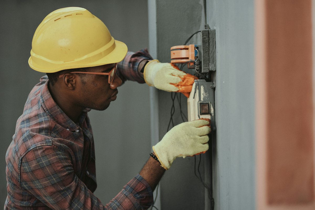 HVAC and electrical technician on a building system